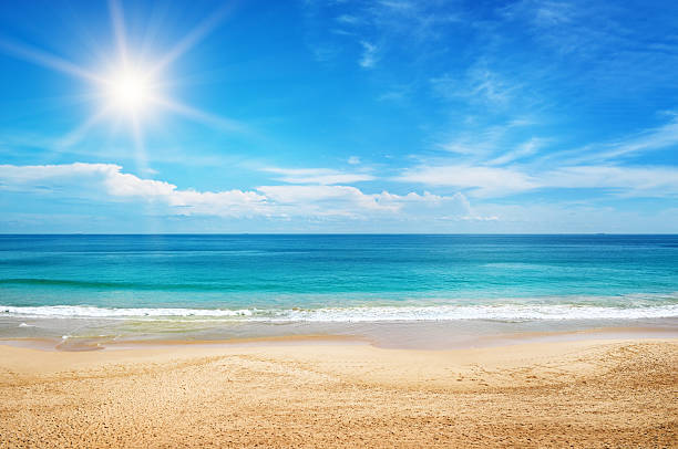 seascape and sun on blue sky seascape and sun on blue sky background standing water photos stock pictures, royalty-free photos & images