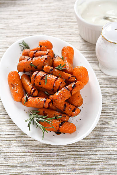 istock Carrots with cream sauce on plate 474970010