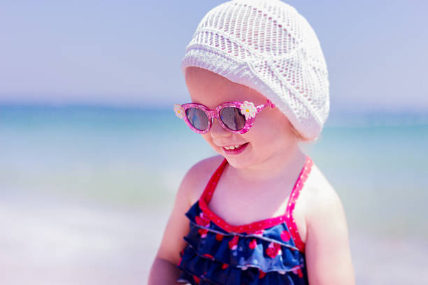 istock Beautiful little girl  on the beach. Selective focus. 474970422