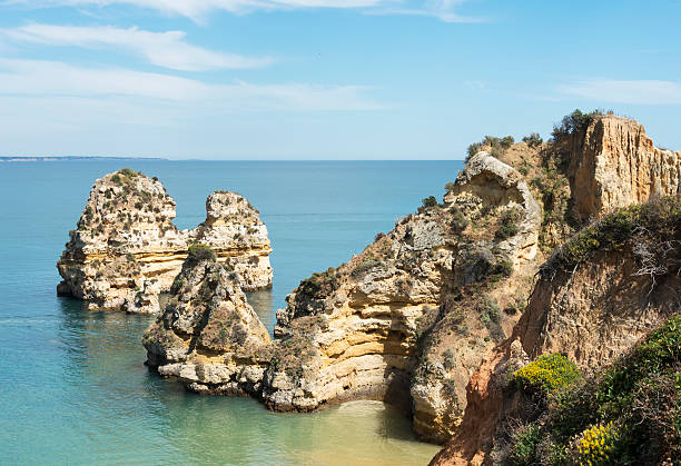 istock rocks and cliff in lagos porugal 474973374