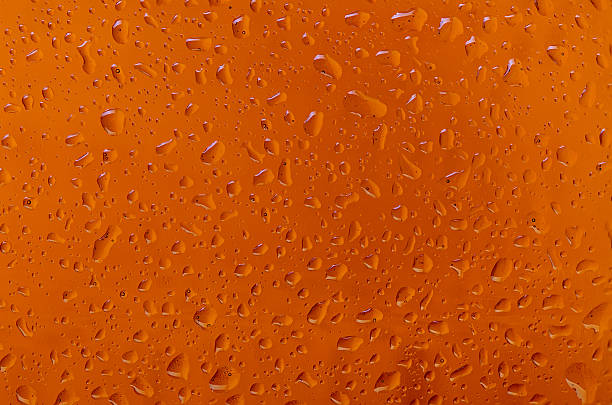 istock Water drops on a beer glass bottle. Background 474973754