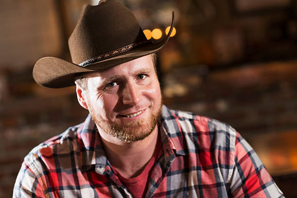 istock Close up of a man wearing a cowboy hat 474975220