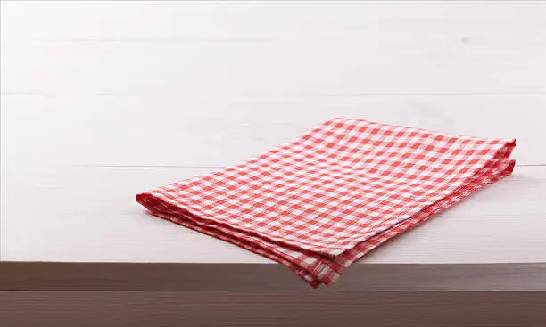 Tablecloth textile on white wooden table background 