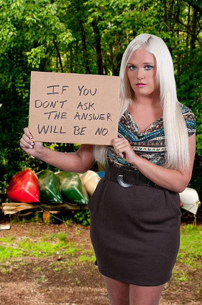 istock Woman Holding a Sign 474978309