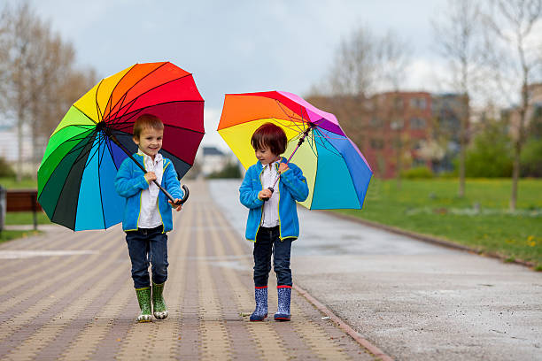 istock Two adorable little boys, walking in a park 474980524
