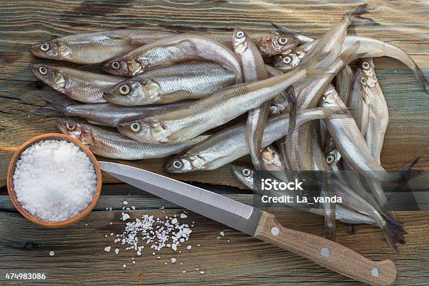 Freshly Caught Small Fish Smelt On A Wooden Surface Stock Photo - Download Image Now