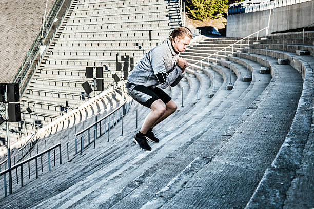 Man excercising in the city using urban structures
