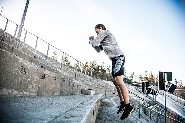 istock Man excercising in the city using urban structures 474986598