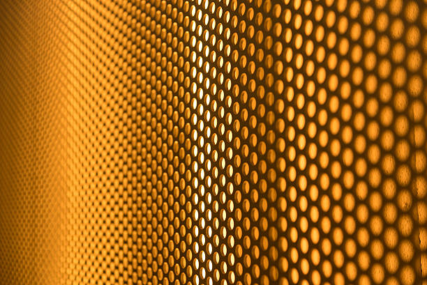 istock golden perforated metal background 474986854