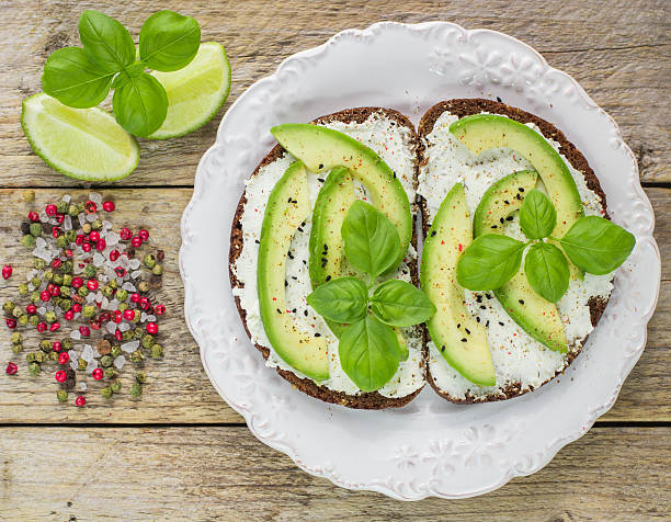 istock Bruschetta with cream cheese, avocado and freshly ground pepper 474987092