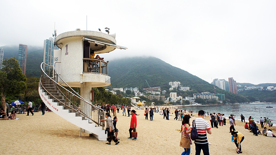 Hong Kong, Hong Kong S.A.R. - April 19, 2015: Local and tourist are gathering on the Repulse Bay even in a Stormy day.