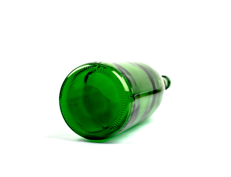 Green beer bottle neck on the screen background