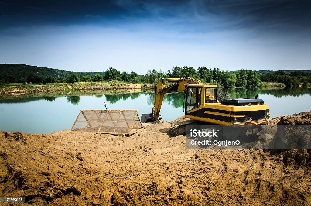 Excavator on gravel pit 2015 Stock Photo