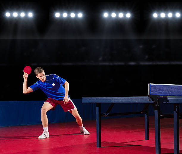 istock Table tennis player at sports hall 474997156