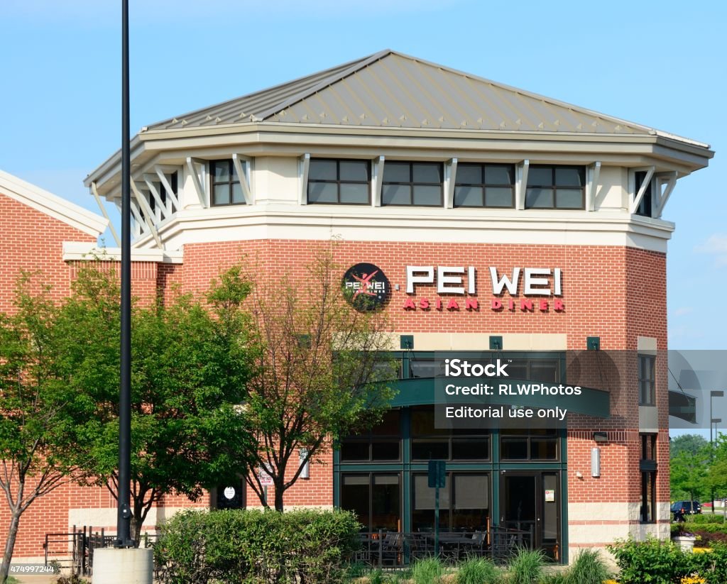 Pei Wei Restaurant Gainesville, Virginia, USA - May 24, 2015: The Pei Wei restaurant is seen on a beautiful, clear blue sky day. Pei Wei currently has 190 locations in the United States and 3 international locations. A spin off of P.F. Chang's, it is now owned by Centerbridge Partners, L.P.  2015 Stock Photo