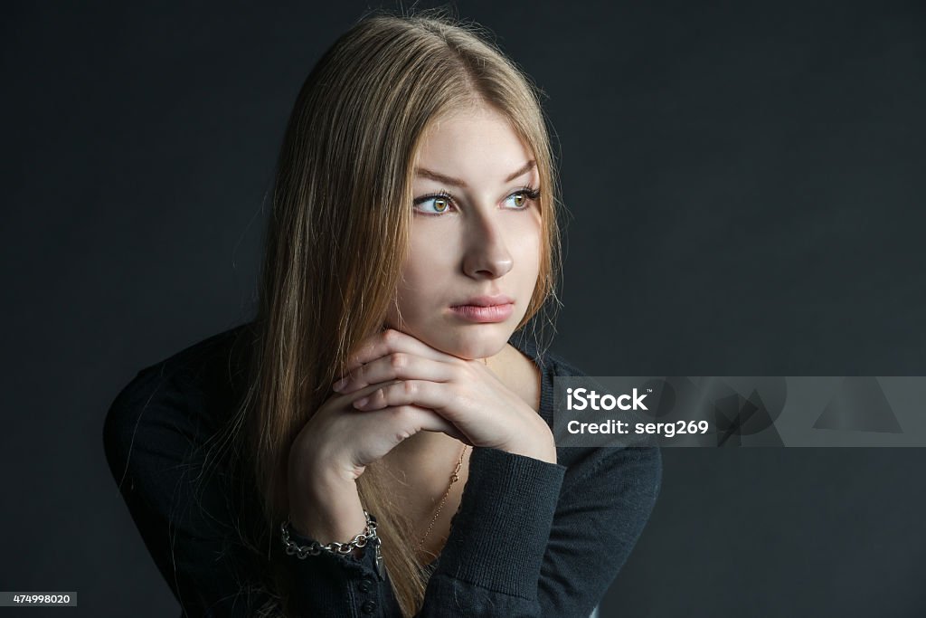Spiritual portrait of the Russian beautiful girl with long hair Spiritual and mental studio portrait of the Russian beautiful teenage girl with light long hair 2015 Stock Photo