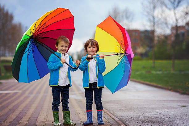istock Two adorable little boys, walking in a park 474998540