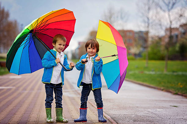 istock Two adorable little boys, walking in a park 474998542