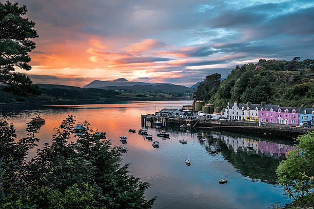Portree Dawn Dawn breaks over the colourful harbour of Portree, Isle of Skye. isle of skye stock pictures, royalty-free photos & images