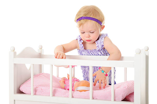 istock Comforting Her Baby Doll 475002102