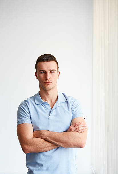 istock Young businessman standing in an office 475002764