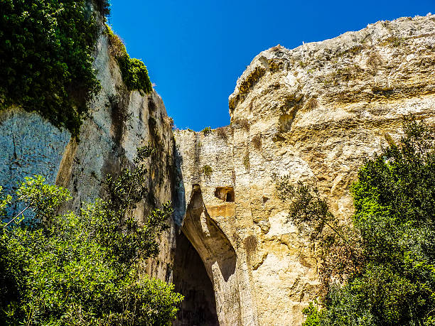 The Ear of Dionysius, ancient Syracuse on Sicily, Italy. The Ear of Dionysius, near ancient Syracuse on Sicily, Italy. italian music stock pictures, royalty-free photos & images