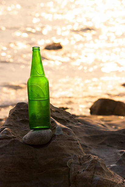 istock Bottles of beer on the rocks 475004968