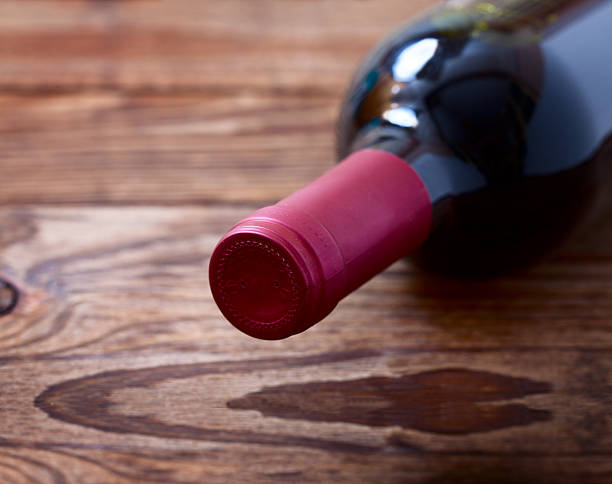 istock Wine bottles on wooden background 475005600