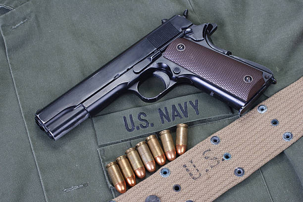 istock colt goverment 1911 with us navy uniform 475005796