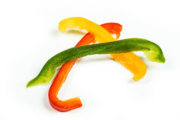 tre fettine di giallo, rosso e verde peperoni - pepper bell pepper portion vegetable foto e immagini stock