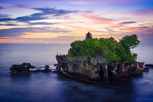 Sunset in Tanah Lot Tahan Lot Hindu temple in Bali, on sunset. tanah lot temple bali indonesia stock pictures, royalty-free photos & images