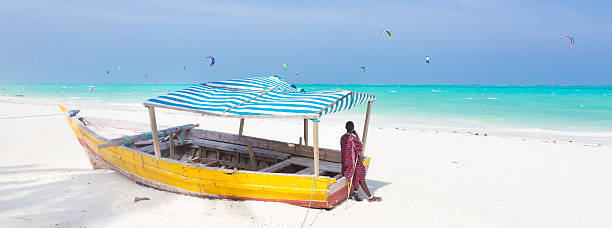 istock White tropical sandy beach on Zanzibar. 475009342