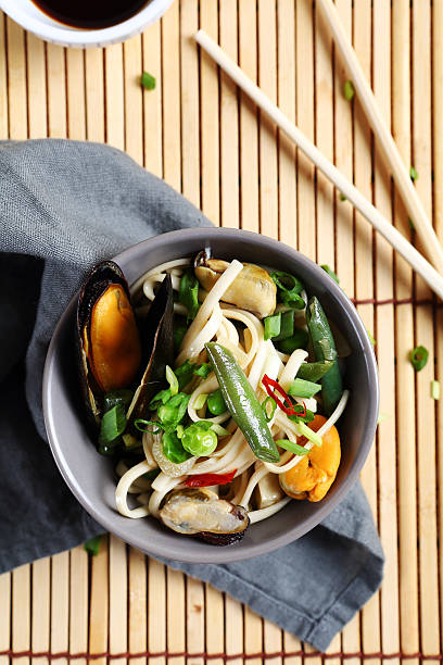 istock Chinese noodles with mussels in a bowl 475010454