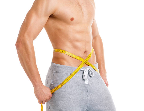 istock Sport man with measuring tape on the white 475021044