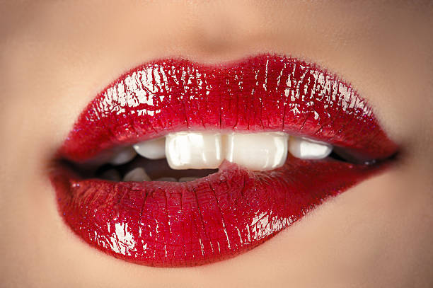 sinnliche lippen - biting lip stock-fotos und bilder