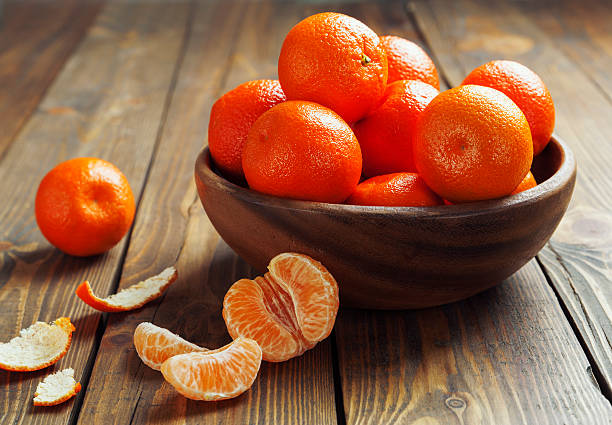 istock Mandarins in the wooden bowl 475024577