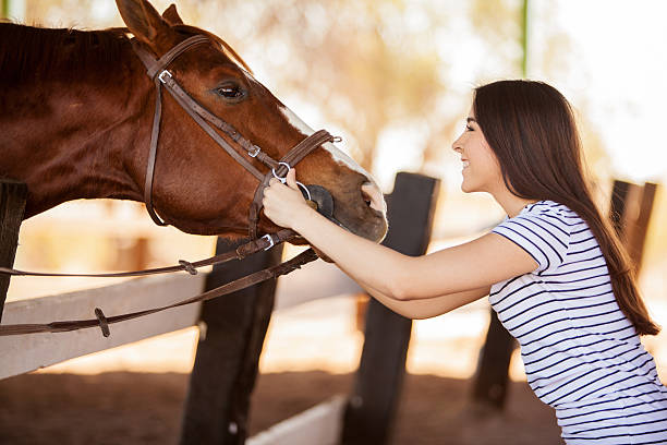 istock Young woman loving her horse 475025523