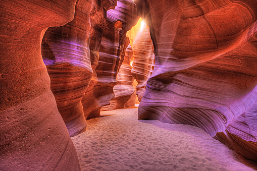 Page, USA - October 13, 2018: Tourist man looking up inside Lower Antelope Slot Canyon in Page,Arizona, USA