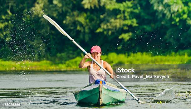 Girl Canoeing Stock Photo - Download Image Now - 2015, Adult, Blue