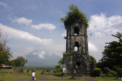 Cagsawa Ruins Church. Bicol. Southeast Luzon. Philippines. The Cagsawa Ruins (also spelled as Kagsawa or Cagsaua) are the remnants of an 18th-century Franciscan church, the Cagsawa church. It was built in 1724, but was destroyed by the eruption of the Mayon Volcano in 1814. It is located in Barangay Busay, Cagsawa, in the municipality of Daraga, Albay, Philippines. The ruins, currently protected in a park overseen by the municipal government of Daraga and the National Museum of the Philippines, are one of the most popular tourist destinations in the area. The International Tourism Bourse, one of the worldâs top travel trade shows based in Berlin, has even recognized the site as one of the places to visit in Asia. The baroque church of Cagsawa was built after 1724 by Franciscan friars under Fray Francisco Blanco in the small town of Cagsawa (spelled as Cagsaua during the Hispanic occupation of the Philippines). It was supposed to replace an earlier church built in 1636 that had been burned down by Dutch pirates.