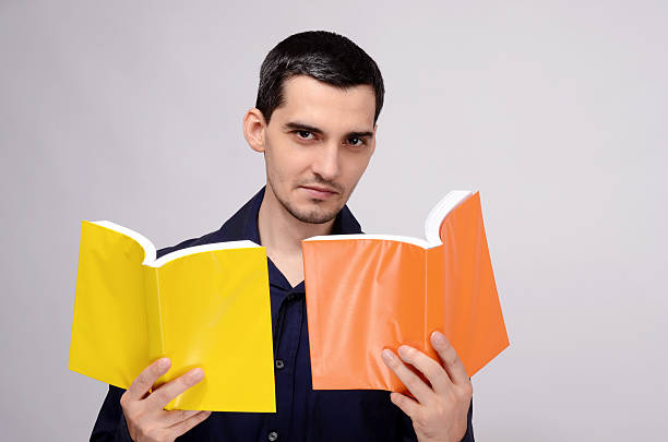 istock Teacher looking at the books with suspicion. Student wondering. 475033359