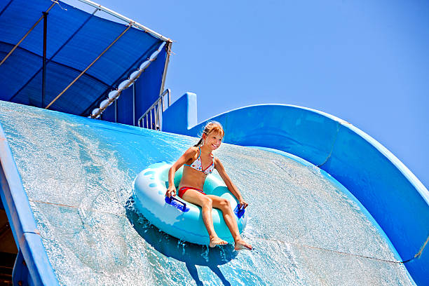 istock Child on water slide at aquapark 475033672