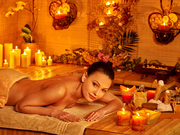 istock Woman getting stone therapy massage 475033716