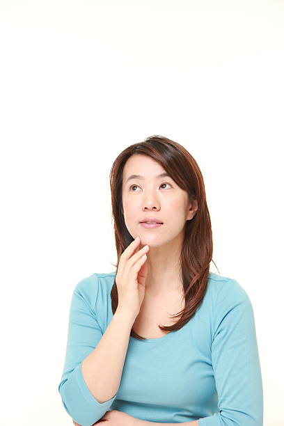 istock Japanese woman thinks about something 475035062