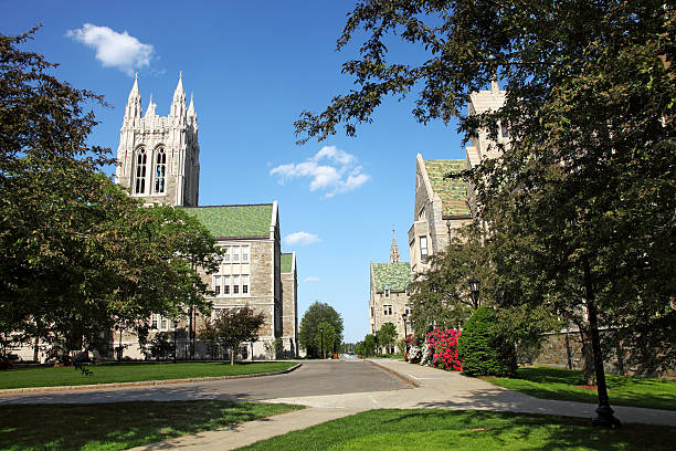 Boston College Chestnut Hill, Massachusetts, USA - May 24, 2015: Daytime view of Collegiate Gothic architecture on the campus of Boston College boston college campus stock pictures, royalty-free photos & images