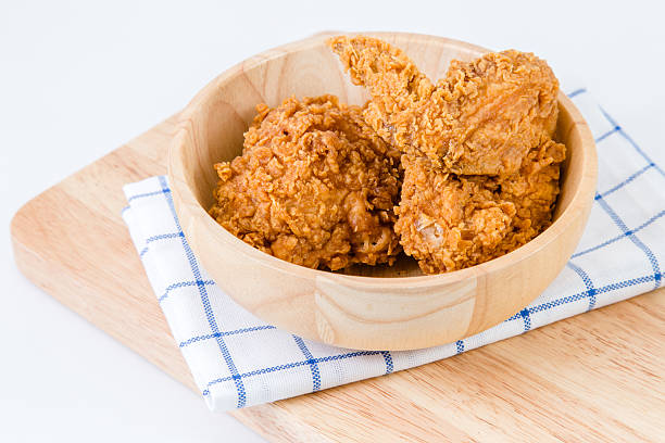 istock Fresh crispy fried chicken in wooden bowl 475035598
