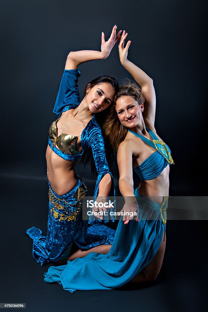 Pair of female belly dancers Pair of female belly dancer wearing blau costumes 2015 Stock Photo