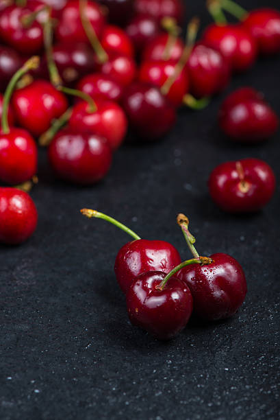istock Fresh ripe organic cherries on black border  background 475037636