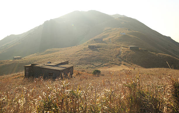 istock Sunset Peak grassland view with abandoned stone house 475037692