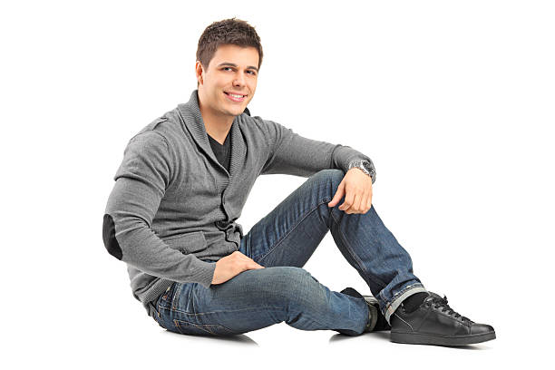 istock Smiling guy sitting on floor and looking at camera 475038515